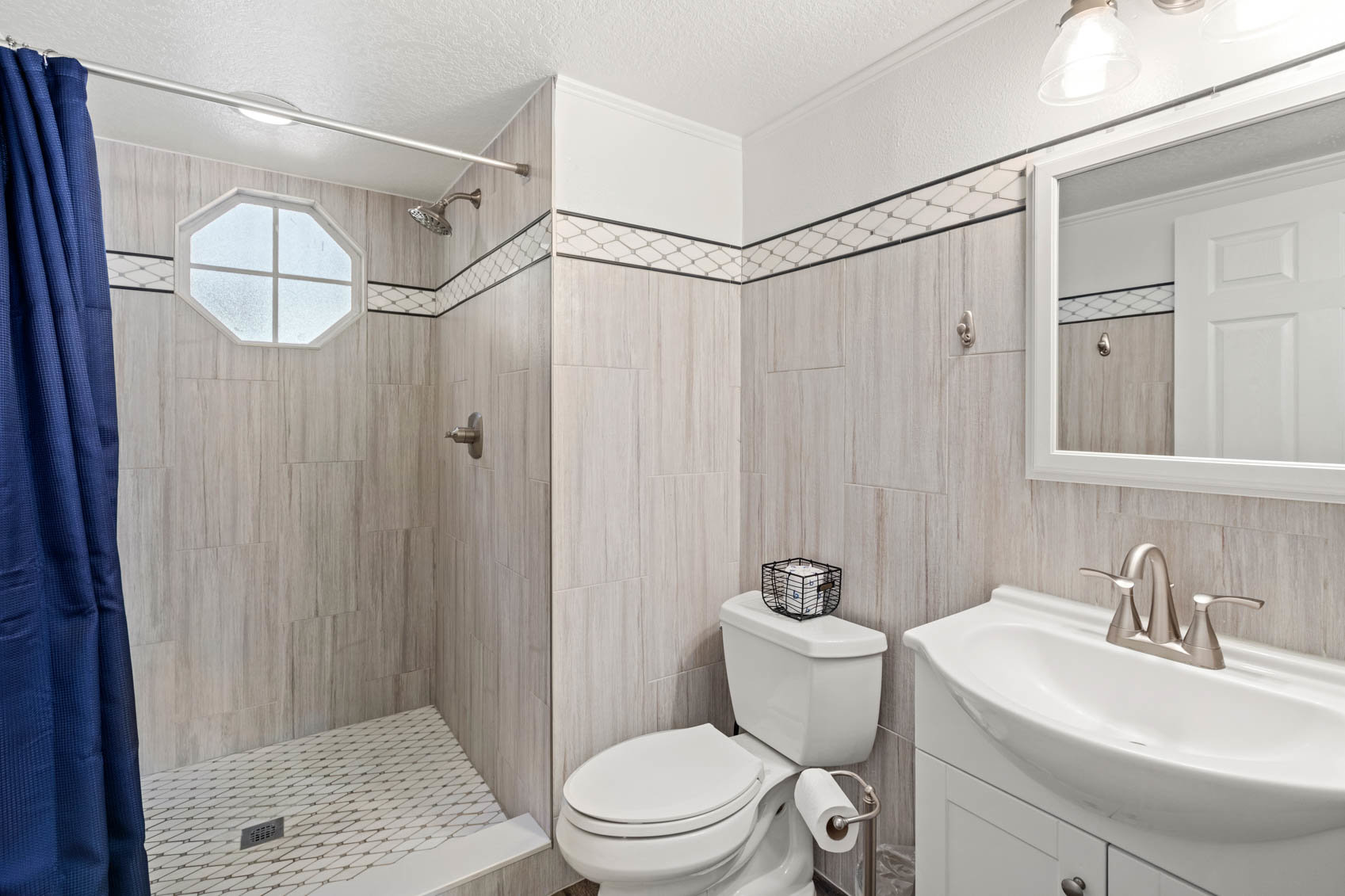 primary bathroom with sink and walk in shower